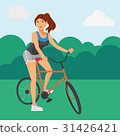 Sportive woman riding a bicycle in the park 31426421