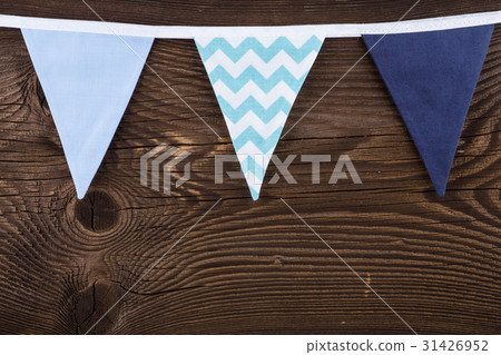 Party triangle bunting flags hanging on the rope.  31426952