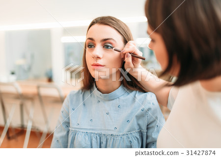 Professional beautician work with woman eyes 31427874