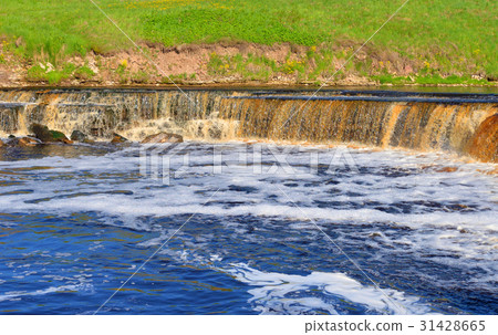 Small waterfall at sunny day. Small waterfall at sunny day. 31428665