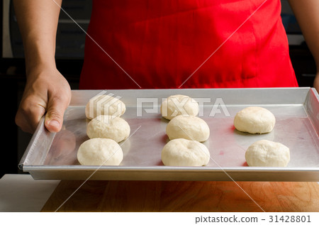 Bun dough ready to bake on baking tray Bun dough ready to bake on baking tray 31428801