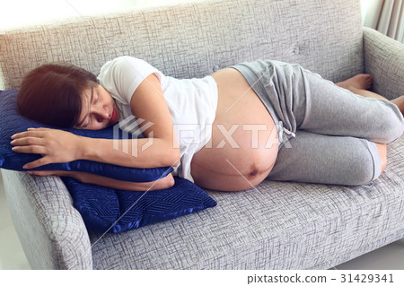 woman pregnant sleeping on sofa furniture woman pregnant sleeping on sofa furniture 31429341