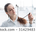 Business woman drawing a concept diagram 31429483