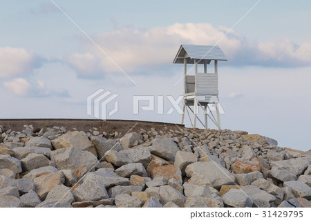 Wooden White lifeguard over rock coastline Wooden White lifeguard over rock coastline 31429795