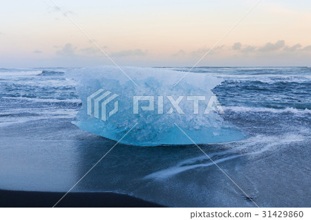 Ice cubed on black sand beach and skyline Ice cubed on black sand beach and skyline 31429860