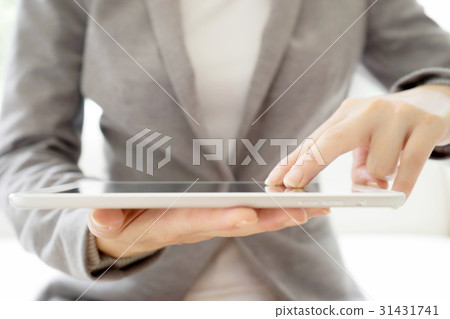 Digital tablet in the hands of businesswomen Digital tablet in the hands of businesswomen 31431741