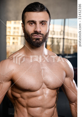 Caucasian sexy fitness model in gym close up abs. Caucasian sexy fitness model in gym close up abs. 31432386