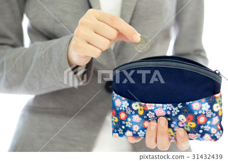 Businesswomen hands holding british coin  31432439