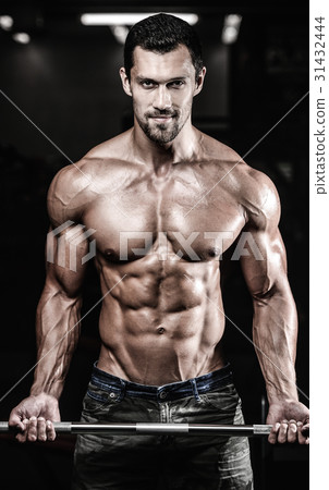 Handsome power athletic man on diet training pumping up muscles Handsome power athletic man on diet training pumping up muscles 31432444