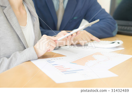 Business adviser analyzing financial figures 31432489