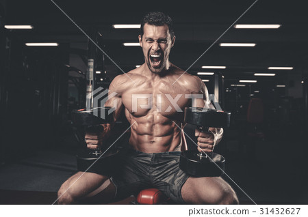 Caucasian sexy fitness male model execute exercise with dumbbell Caucasian sexy fitness male model execute exercise with dumbbell 31432627