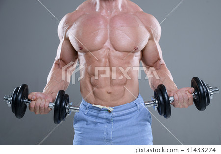 Handsome power athletic man on diet training pumping up muscles Handsome power athletic man on diet training pumping up muscles 31433274