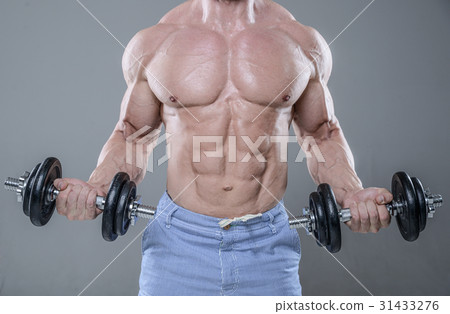 Handsome power athletic man on diet training pumping up muscles Handsome power athletic man on diet training pumping up muscles 31433276