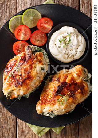 Chicken fillet stuffed with cheese and spinach Chicken fillet stuffed with cheese and spinach 31433694
