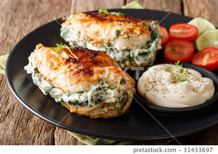 Baked Chicken stuffed with cheese and spinach Baked Chicken stuffed with cheese and spinach 31433697
