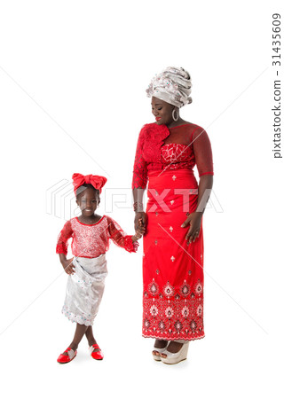 African woman and little girl in traditional dress African woman and little girl in traditional dress 31435609
