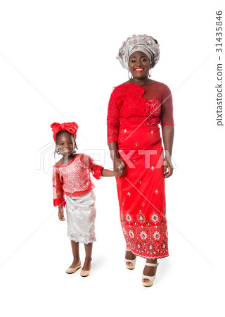 African woman and little girl in traditional dress African woman and little girl in traditional dress 31435846