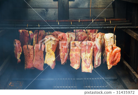 Ham, sausage in a homemade smokehouse Ham, sausage in a homemade smokehouse 31435972