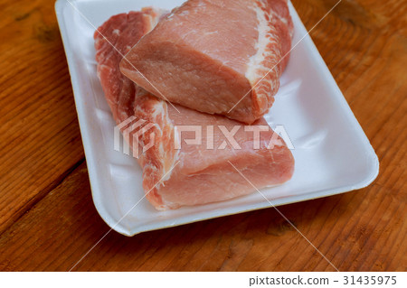 Raw meat pork tenderloin on cutting board  31435975