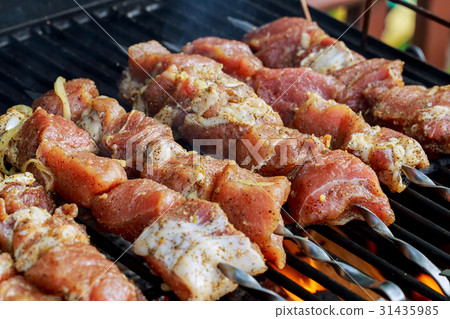 Marinated shashlik preparing on a barbecue 31435985