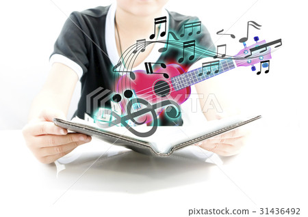 Open music book and ukulele 31436492