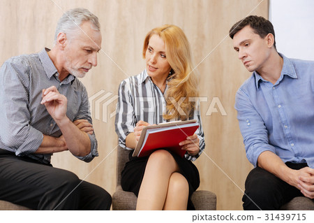 Nice serious man looking at the notes 31439715