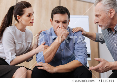 Sad cheerless man suffering from depression 31440354