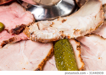 Delicious sliced roast beef with pickled cucumber. Delicious sliced roast beef with pickled cucumber. 31440939