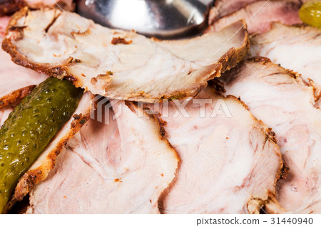 Delicious sliced roast beef with pickled cucumber. Delicious sliced roast beef with pickled cucumber. 31440940