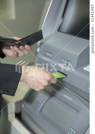 Men with cash with ATM Men with cash with ATM 31441497