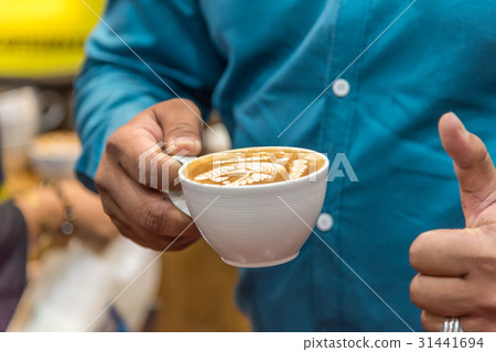 Barista pouring latte froth make coffee latte art Barista pouring latte froth make coffee latte art 31441694