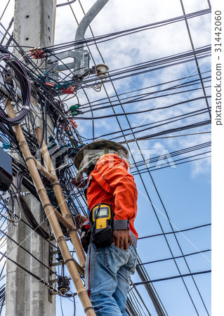 Working to install electric line 31442060
