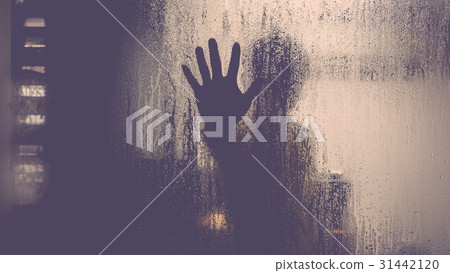 Silhouette of man on glass with drop in computer server room 31442120