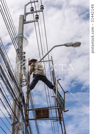 Working to install electric line 31442149