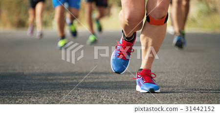 Marathon running race in the light of evening 31442152