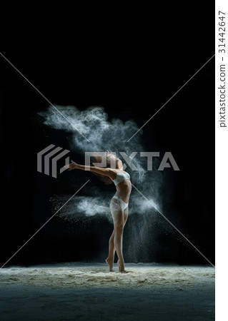 Girl in a cloud of white dust studio portrait Girl in a cloud of white dust studio portrait 31442647
