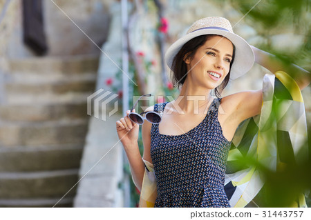 attractive woman tourist with hat in old european town attractive woman tourist with hat in old european town 31443757