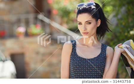 attractive woman tourist  with hat in old european town 31443758