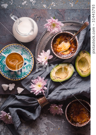 Still life with Catalan cream , avocado and coffee Still life with Catalan cream , avocado and coffee 31443793