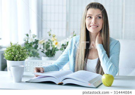 young woman with opened book 31444084