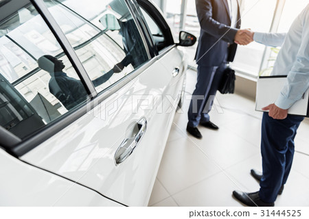 Business deal concerning purchase of new car Business deal concerning purchase of new car 31444525