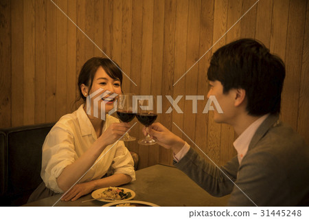 A couple drinking in a private room A couple drinking in a private room 31445248