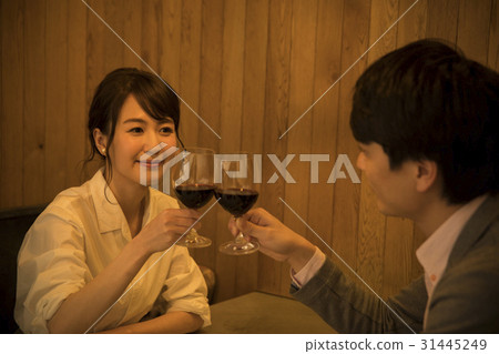 A couple drinking in a private room A couple drinking in a private room 31445249