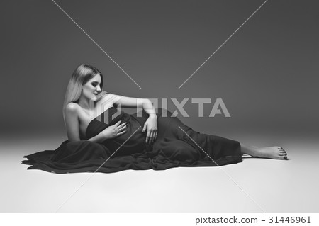 Pregnant girl in red dress Pregnant girl in red dress 31446961