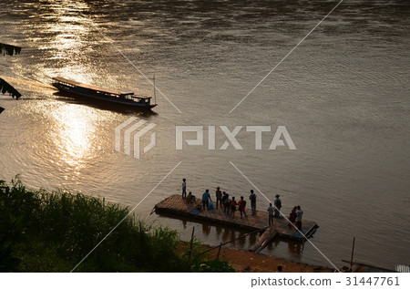 World Heritage Sites in Laos Luang Prabang at dusk People waiting for a mecha cruise and boarding World Heritage Sites in Laos Luang Prabang at dusk People waiting for a mecha cruise and boarding 31447761