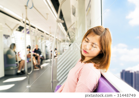 Young woman sleep while taking the sky train Young woman sleep while taking the sky train 31448749