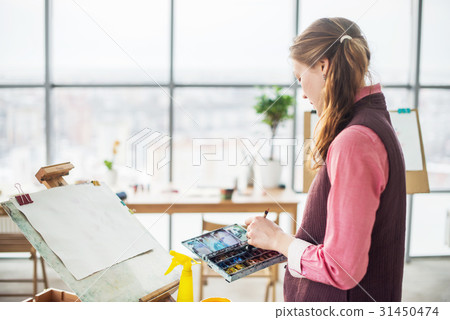 Portrait of a young woman painter drawing with Portrait of a young woman painter drawing with 31450474