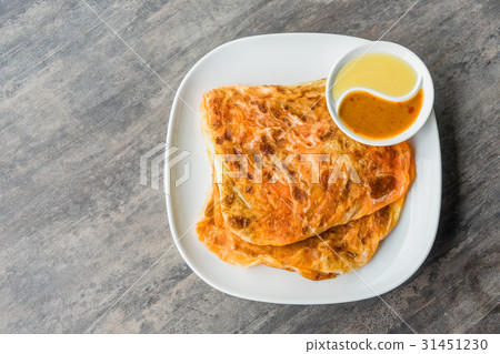 Indian Roti Prata with Condensed milk and Curry Indian Roti Prata with Condensed milk and Curry 31451230