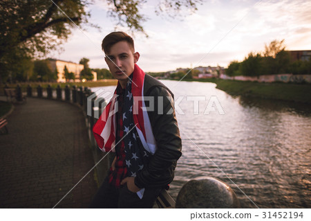 Guy with american flag on sunset Guy with american flag on sunset 31452194
