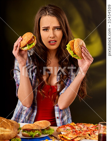 Girl eating big sandwich. Girl eating big sandwich. 31454509